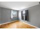 Bright bedroom featuring hardwood floors and gray walls at 8010 W Chestnut Dr, Littleton, CO 80128