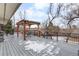 Back deck with pergola, providing a relaxing outdoor space at 8010 W Chestnut Dr, Littleton, CO 80128