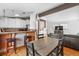 Kitchen features a dining area with a table and chairs near the kitchen at 8010 W Chestnut Dr, Littleton, CO 80128