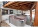 Hot tub located on patio under covered deck at 8010 W Chestnut Dr, Littleton, CO 80128