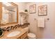 Bathroom featuring a vanity with a sink, decorative accents, and a shower at 6839 E Briarwood Dr, Centennial, CO 80112