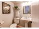 Bathroom featuring a white pedestal sink, decorative mirror, and stylish accents at 6839 E Briarwood Dr, Centennial, CO 80112