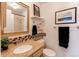 Bathroom with shower/tub combo, tiled walls, and a granite countertop at 6839 E Briarwood Dr, Centennial, CO 80112