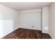 An empty bedroom features dark wood floors, neutral walls, and space for customization at 6839 E Briarwood Dr, Centennial, CO 80112