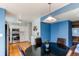 Dining area with round table, four chairs, and a view into the kitchen at 6839 E Briarwood Dr, Centennial, CO 80112