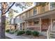 Row of townhomes with brick and siding exteriors, front porches, and landscaping at 6839 E Briarwood Dr, Centennial, CO 80112