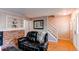 Living room with hardwood floors, fireplace, and stairs to upper level at 6839 E Briarwood Dr, Centennial, CO 80112