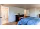 Main bedroom with en-suite bathroom, dresser, and closet space at 6839 E Briarwood Dr, Centennial, CO 80112