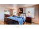 Main bedroom with large bed, ample closet space, and window coverings at 6839 E Briarwood Dr, Centennial, CO 80112