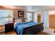 Main bedroom with large bed, ample closet space, and window coverings at 6839 E Briarwood Dr, Centennial, CO 80112