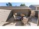 A private backyard patio showcases outdoor seating and string lights for relaxation and entertainment at 6839 E Briarwood Dr, Centennial, CO 80112