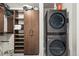 A closet with ample storage space and a stacked washer and dryer at 891 14Th St # 2712, Denver, CO 80202