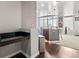 Kitchen features a modern island with a stainless steel sink and an adjacent workspace at 891 14Th St # 2712, Denver, CO 80202