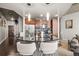 Kitchen with stainless steel appliances, breakfast bar, and modern hanging lights at 891 14Th St # 2712, Denver, CO 80202