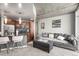 Open concept living room and kitchen with plush seating and a modern island at 891 14Th St # 2712, Denver, CO 80202