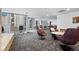 Comfortable lounge area featuring various seating arrangements, tables, and floor-to-ceiling windows at 891 14Th St # 2712, Denver, CO 80202
