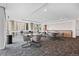 Well-lit lounge space including tables, chairs, counter seating, plus a kitchenette with sink and cabinets at 891 14Th St # 2712, Denver, CO 80202