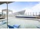 Outdoor rooftop pool and hot tub with lounge chairs and clear views of the city at 891 14Th St # 2712, Denver, CO 80202
