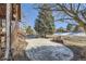 Patio with large evergreen trees for privacy in the backyard, a comfortable outdoor space at 27 Buckthorn Dr, Littleton, CO 80127