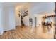 Spacious living area leading to dining room, featuring hardwood floors and elegant lighting at 27 Buckthorn Dr, Littleton, CO 80127