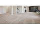 Spacious carpeted basement featuring neutral walls and decor at 9759 Waco St, Commerce City, CO 80022