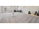 Spacious finished basement area with modern gray carpet and plenty of room for activities and storage at 9759 Waco St, Commerce City, CO 80022