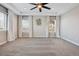 Primary bedroom featuring a ceiling fan, neutral walls, and soft carpeting at 9759 Waco St, Commerce City, CO 80022