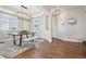 Dining room with modern chandelier, bench, and light-filled windows at 9759 Waco St, Commerce City, CO 80022
