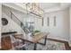 Elegant dining room with modern lighting, stylish furniture, and an open layout at 9759 Waco St, Commerce City, CO 80022