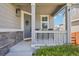 A cozy front porch with outdoor seating, perfect for relaxing and enjoying the neighborhood at 9759 Waco St, Commerce City, CO 80022