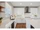 Bright and modern kitchen with white cabinets, quartz counters, and stainless steel appliances at 9759 Waco St, Commerce City, CO 80022