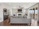 Bright living room with fireplace, large sliding glass doors to the deck, and comfortable seating at 9759 Waco St, Commerce City, CO 80022