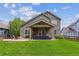 Spacious backyard featuring a covered patio perfect for outdoor entertaining and relaxation at 16662 W 61St Pl, Arvada, CO 80403