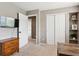 Bedroom features an open doorway and ample closet space at 16662 W 61St Pl, Arvada, CO 80403