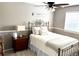 Cozy bedroom with vintage bed frame and natural light at 16662 W 61St Pl, Arvada, CO 80403