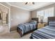 Twin bedroom features two beds and carpeted floors at 16662 W 61St Pl, Arvada, CO 80403