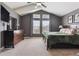 Well-lit bedroom featuring vaulted ceilings, neutral carpet, and a decorative dresser at 16662 W 61St Pl, Arvada, CO 80403