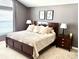 Comfortable bedroom with a large bed and neutral decor at 16662 W 61St Pl, Arvada, CO 80403