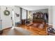 Inviting entryway featuring hardwood floors and a convenient space for a home office at 16662 W 61St Pl, Arvada, CO 80403
