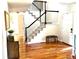 Entryway with staircase, wooden floors, and natural light at 16662 W 61St Pl, Arvada, CO 80403