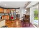 Spacious kitchen leading to the dining area and a sliding glass door to the backyard at 16662 W 61St Pl, Arvada, CO 80403