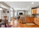 Open-concept kitchen featuring stainless steel appliances and views of the living room at 16662 W 61St Pl, Arvada, CO 80403