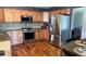 Spacious kitchen with stainless steel appliances and ample cabinet space at 16662 W 61St Pl, Arvada, CO 80403