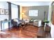 Comfortable sitting area with modern chairs, wood floors, and natural lighting at 16662 W 61St Pl, Arvada, CO 80403
