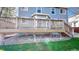 View of the wooden deck with railings, steps down to the backyard, and the home's light blue siding at 9567 W 107Th Dr, Broomfield, CO 80021