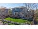 Two-story home featuring a well-manicured backyard and deck at 9567 W 107Th Dr, Broomfield, CO 80021