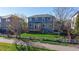Spacious backyard, two story home, deck, and white fence at 9567 W 107Th Dr, Broomfield, CO 80021