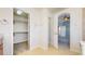 Bright bathroom showing a walk-in closet, and open doorway into the adjacent bedroom at 9567 W 107Th Dr, Broomfield, CO 80021