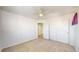 Bedroom with neutral carpet, ceiling fan, and a double-door closet at 9567 W 107Th Dr, Broomfield, CO 80021