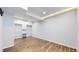 Bright bedroom with wood-look flooring, closet, and light blue walls at 9567 W 107Th Dr, Broomfield, CO 80021
